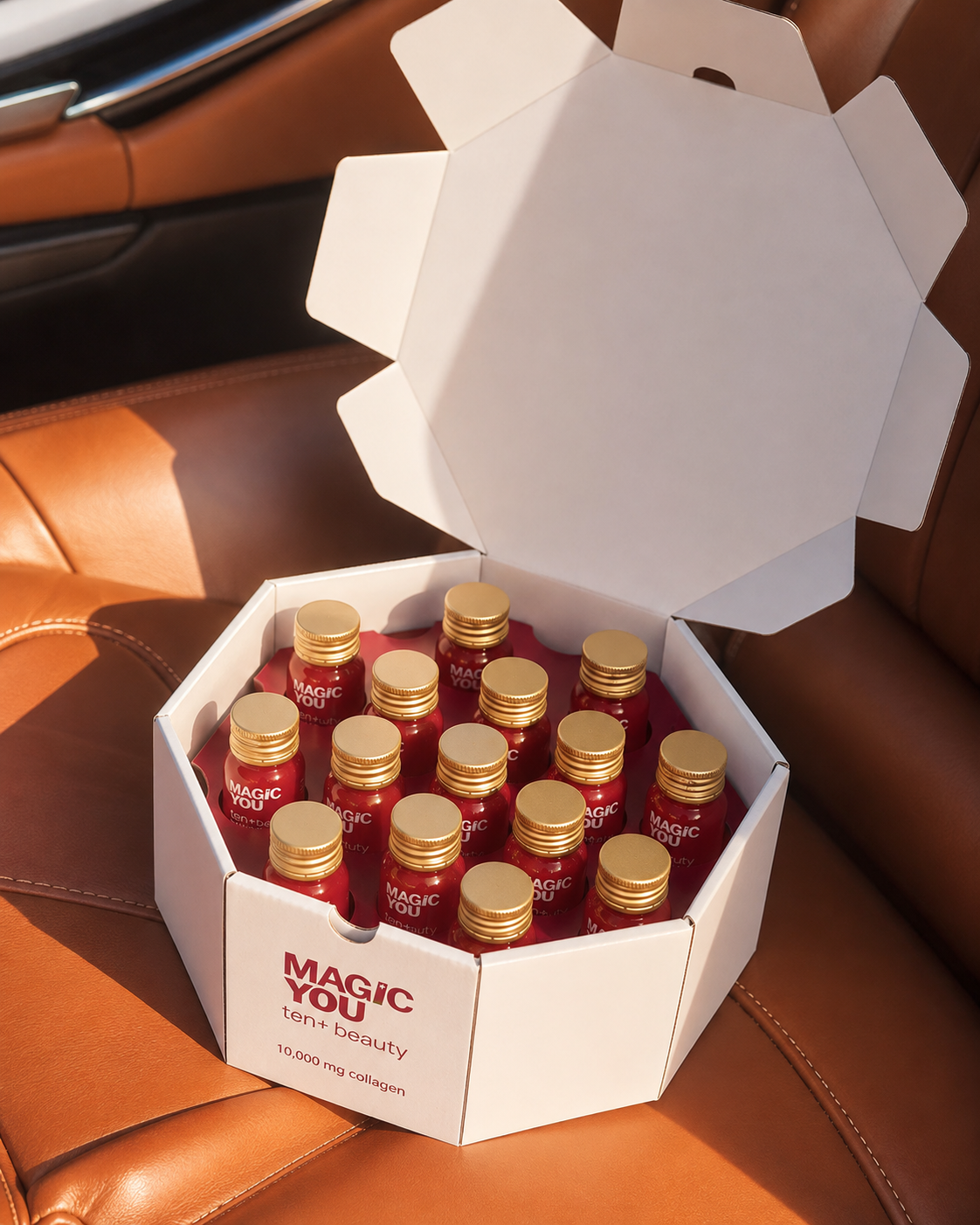 Open Magic You collagen box on cognac leather car seat
