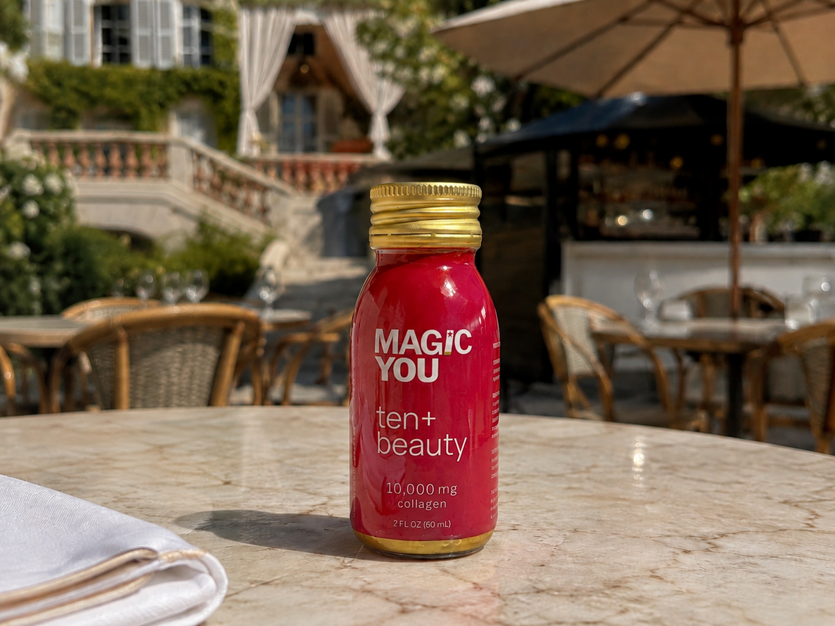 Magic You ten+beauty bottle on a luxury St. Tropez cafe table