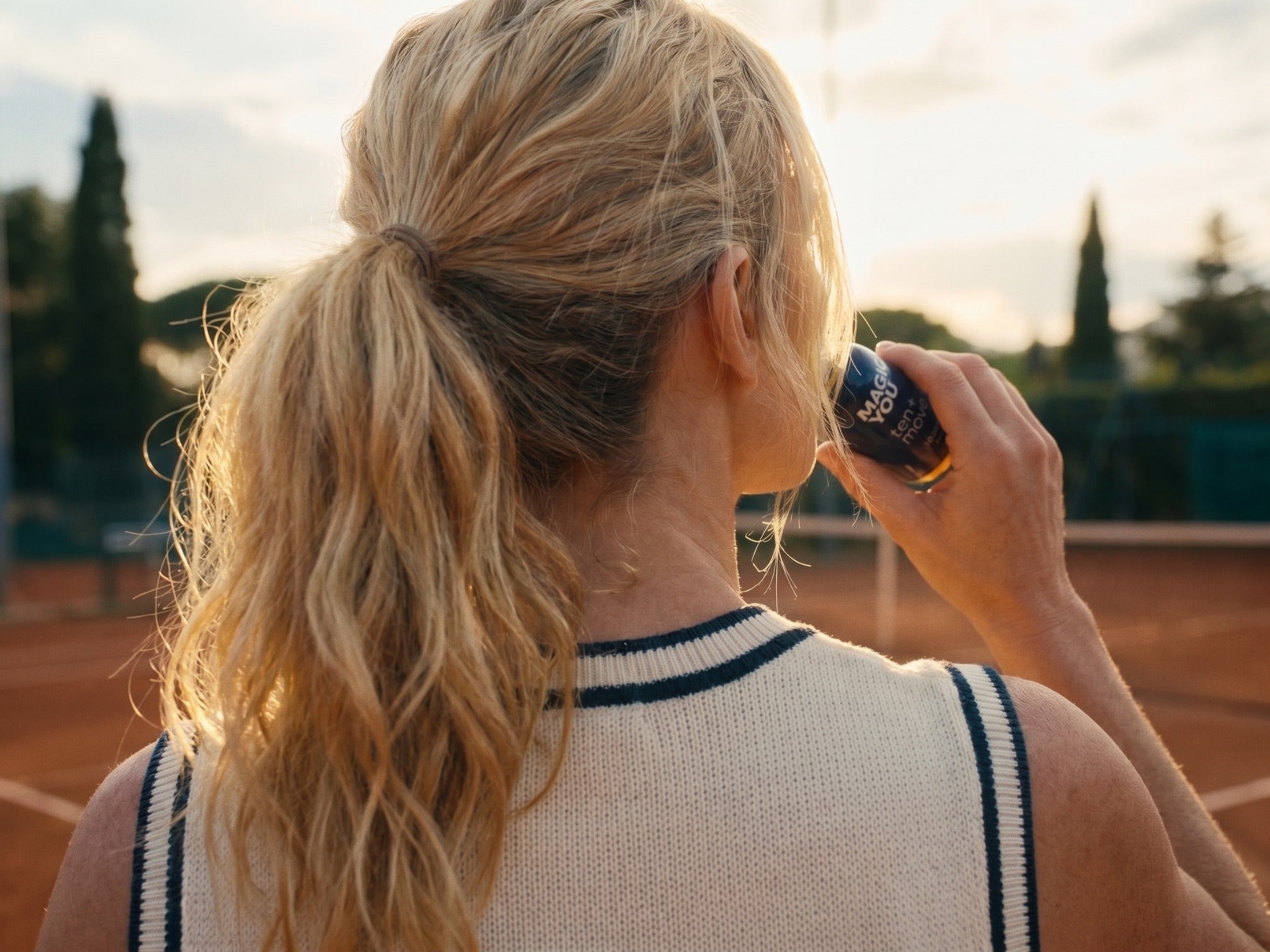 Woman enjoying Magic You ten+move after tennis on a clay court